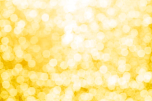 gold abstract background with bokeh defocused lights photo