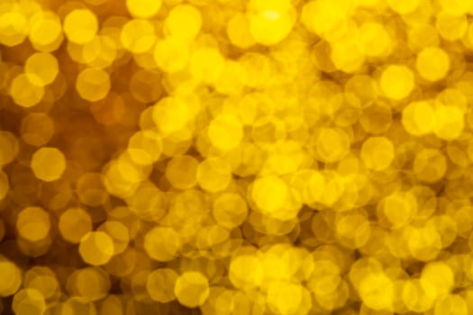 Glitter festive christmas lights background. light and gold de focused texture photo