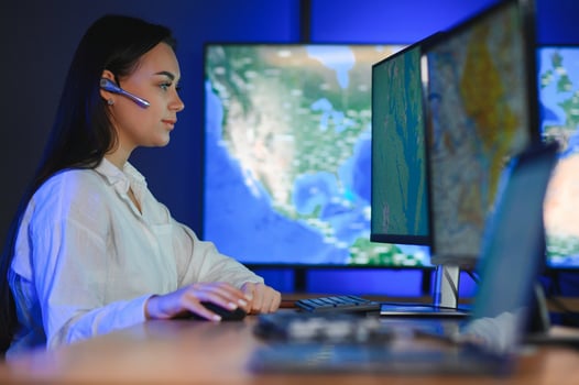 Photo of a successful dispatcher working on a computer in the office