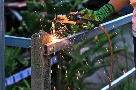 Metal welding. Welding metal structures causes sparks. Safety concept in dangerous workplace photo