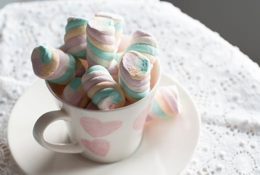light pink and white marshmallows in a beautiful ceramic cups with pink hearts, Concept Mother's Day gift, Valentine's Day, High quality photo