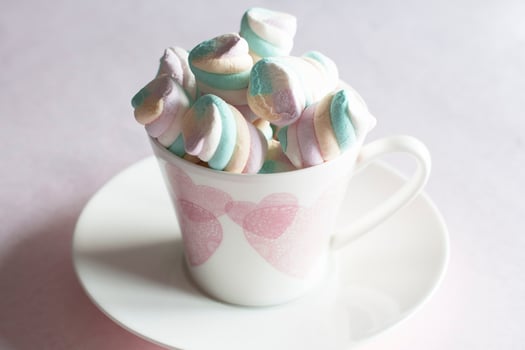 light pink and white marshmallows in a beautiful ceramic cups with pink hearts, Concept Mother's Day gift, Valentine's Day, High quality photo