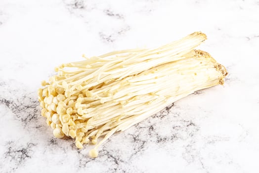 Tasty raw enoki mushroom heap photo