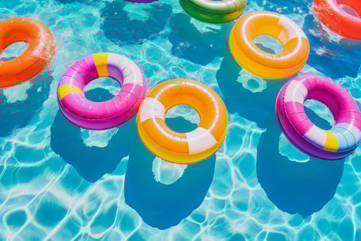 lots of inflatable rings floating on the water photo