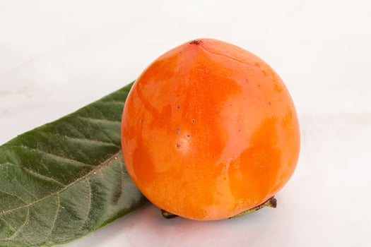 Fresh ripe sweet juicy persimmon photo