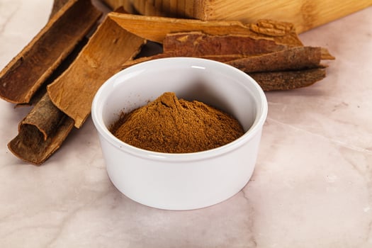 Natural Cinnamon powder with sticks photo