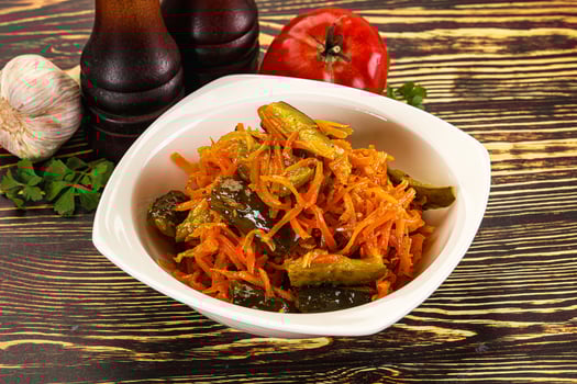 Salad with korean carrot and cucumber photo