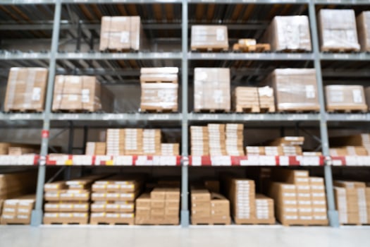 Abstract Blurred Storage Warehouse Logistics. Blurred industrial warehouse with goods and products. Logistics, business, delivery, services concept. Defocused industrial storehouse interior. photo