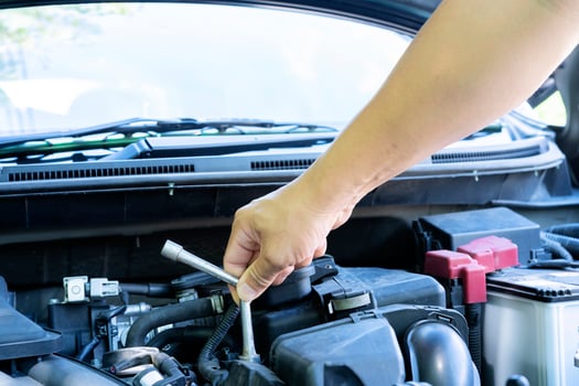 Automotive mechanic working in garage. Repair service. Mechanic working on a diesel engine, close up. Technician hands of car mechanic in doing auto repair service and maintenance worker repairing photo