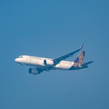 New Delhi, India, June 10 2024 - Vistara Airbus A320 neo take off from Indra Gandhi International Airport Delhi, Vistara domestic aeroplane flying in the blue sky during day time photo