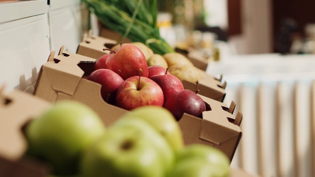 Close up zoom out shot of organic fruits and vegetables on farmers market shelves. Freshly harvested chemicals free food items in environmentally friendly zero waste supermarket photo