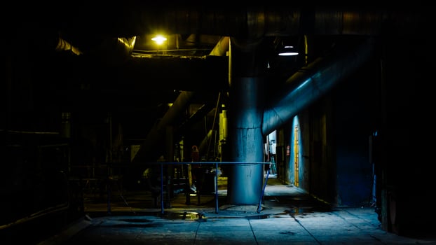 Giant pipes, tubes and equipment inside modern industrial power plant, night scene. Industrial night scene. photo