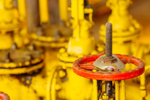 Close up of manual operate ball valve at factory. Pipes and valves industrail equipment. photo
