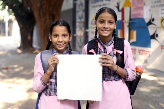 Close-Up View Of An Indian Student Smiling And Looking At The Front Camera photo