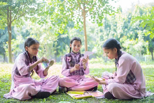 Two Girl Young Mates Prepare For Exams In The Park photo