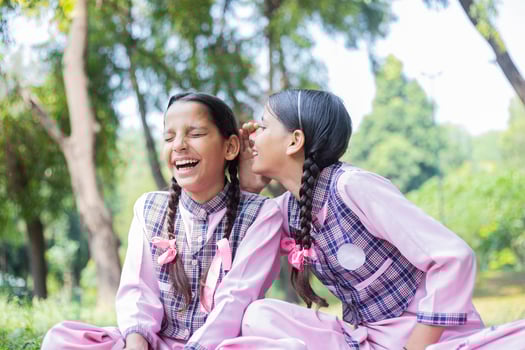 Close Up Image Of A Skillful Girl Student Looking Up While Sitting In The Park photo