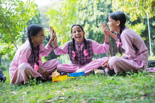 Smiling Girl Student In School Dress Standing With Backpack While Looking At The Camera photo