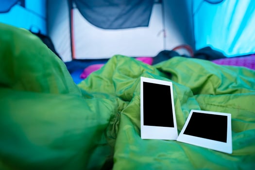 Two polaroids were placed on a sleeping bag in the tent, To record the memories of the trip photo