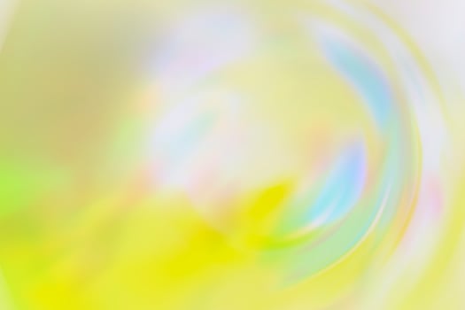The photo is blurred. Texture, background, pattern. Yellow silk fabric. Abstract background of luxury Yellow fabric or liquid wave or wavy grunge texture. The whole background.