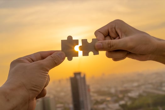 Closeup hand of connecting jigsaw puzzle with sunlight effect, Business solutions, success and strategy concept photo
