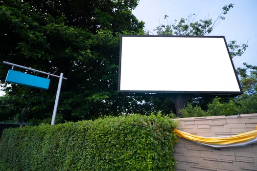 The billboard was installed on the roadside. To add text, images, publicity photo