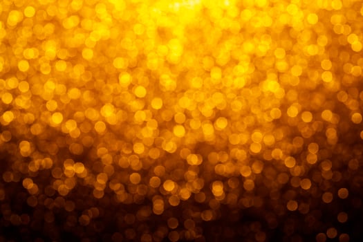 Gold abstract bokeh glitter vintage lights background. dark gold and black. defocused photo