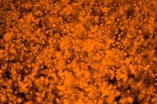 glitter vintage lights background. dark gold and black photo