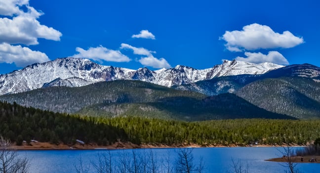 Panorama Snow-capped and forested mountains near a mountain lake, Pikes Peak Mountains in Colorado Spring, Colorado, US photo