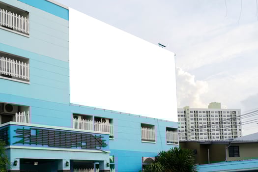 A blank mockup is mounted on a large apartment. photo