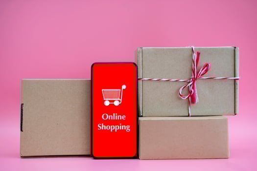 boxes and shopping bag with Smartphone Online Shopping screen. photo