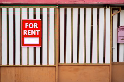 Red for rent real estate sign in front of beautiful house. photo