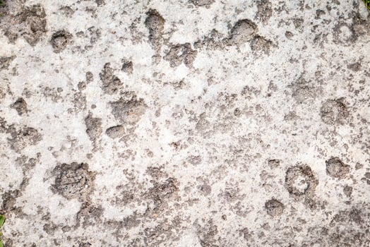 gray stone on earth. the texture of a stone laid on the road photo
