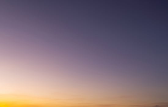 Tranquil Sunrise Sky with Copy Space, Predawn Gradient of Orange and Blue Atmosphere photo