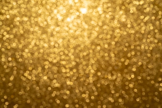 Abstract twinkled bright background with bokeh defocused golden lights photo