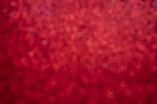 Red glitter vintage lights background, defocused photo