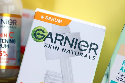 KYIV, UKRAINE - APRIL 20, 2024 Garnier production with company logo. Garnier is a mass market cosmetics brand of French cosmetics company L'Oreal photo