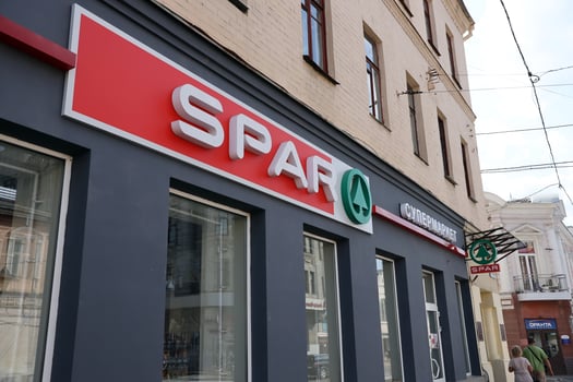 KHARKIV, UKRAINE - AUGUST 29, 2021 Spar logo on a wall. Spar is an international group of independently owned and operated retailers and wholesalers who work together photo