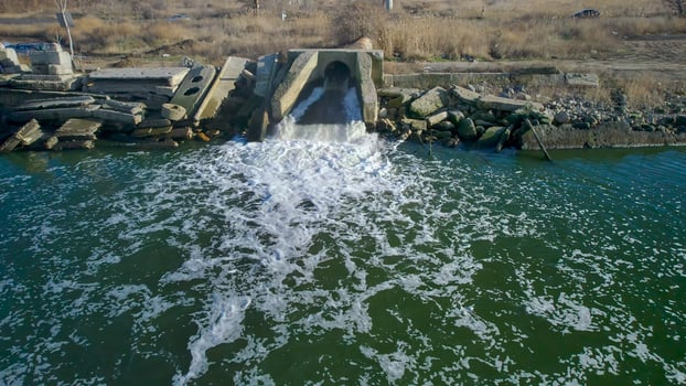 Environmental pollution with dirty sewage photo