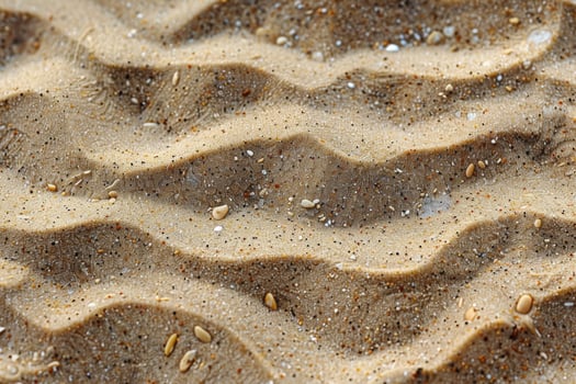 Close-up of sand texture with natural wave patterns, tiny pebbles, and grains in warm tones photo