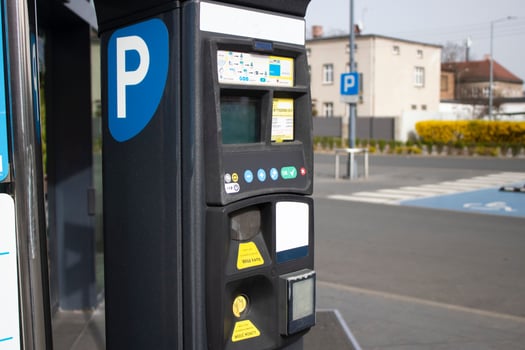 Parking machine on a city street. Car parking payment system photo