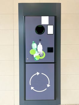 Vending machine for plastic bottles. Reversible Vending Machine for Plastic Waste Recycling photo