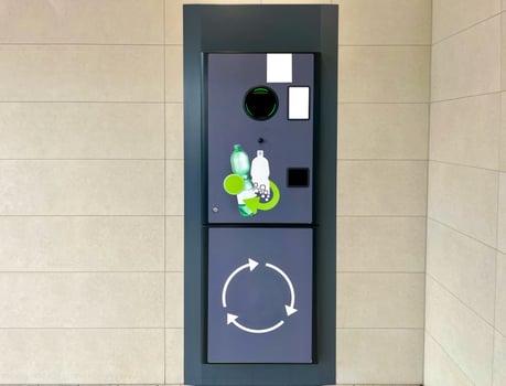 Vending machine for plastic bottles. Reversible Vending Machine for Plastic Waste Recycling photo