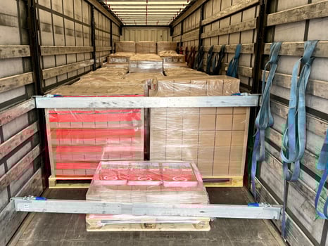 Transportation of cardboard and wooden cargo in a semi-trailer truck photo