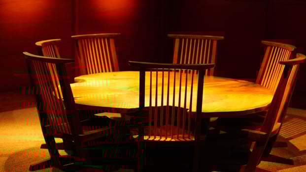 The old wooden table and chairs exhibiting in the museum photo