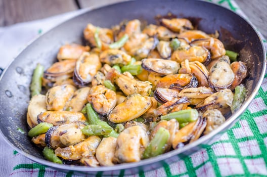 Fried mussels on the pan photo