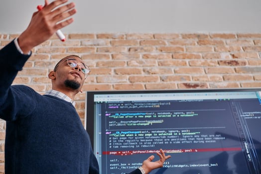 African American businessman delivers a compelling presentation of his business strategy to his colleagues, fostering collaboration and forward thinking photo