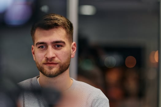 Close-up European Businessman Engaging with Colleagues in Office Discussion photo