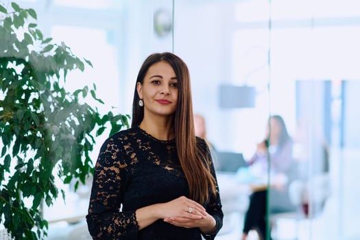 Portrait of a Confident Businesswoman with Crossed Arms in Her Office Environment. photo