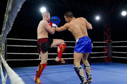 Fierce boxing match showcases athletes' power and skill. photo