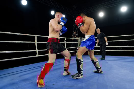 Fierce boxing match showcases athletes' power and skill. photo